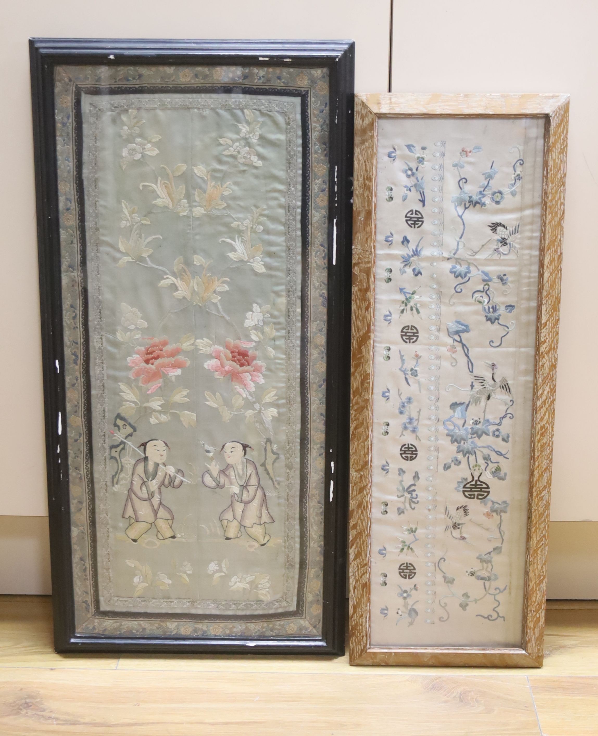 A Chinese embroidered sleeve band and a pair of embroidered sleeve bands (in one frame), largest 64 x 28cm
